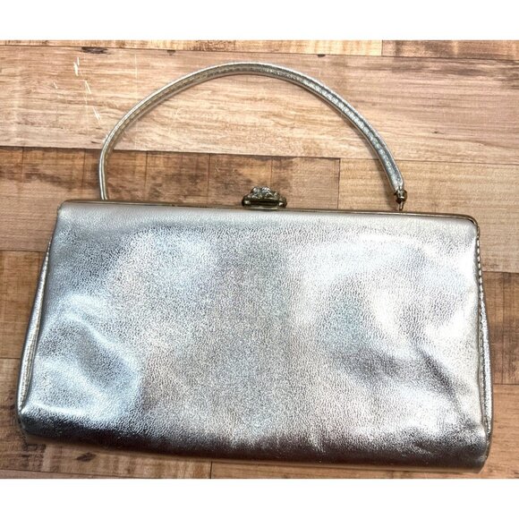 Silver Metallic Clutch Purse With Floral Clasp & Black Interior Lining - Picture 1 of 3